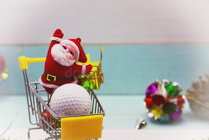 Santa is shopping golf ball for golfer`s gift on Christmas holiday. Santa is shopping golf ball for golfer`s gift on Christmas holiday