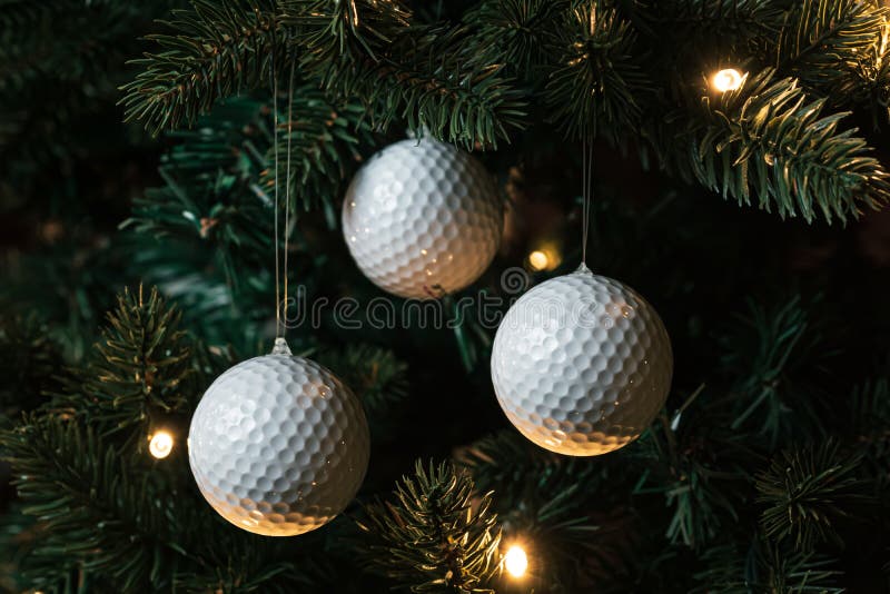 Golf balls on the Christmas tree. Golf balls on the Christmas tree