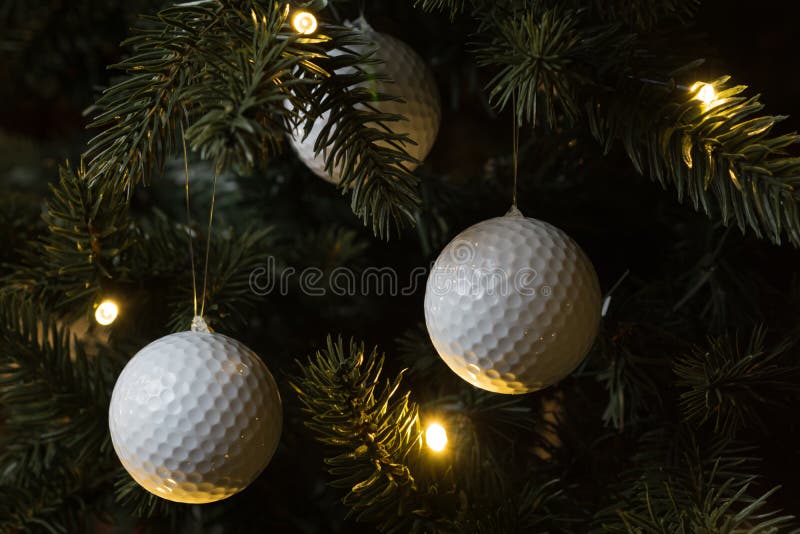 Golf balls on the Christmas tree. Golf balls on the Christmas tree