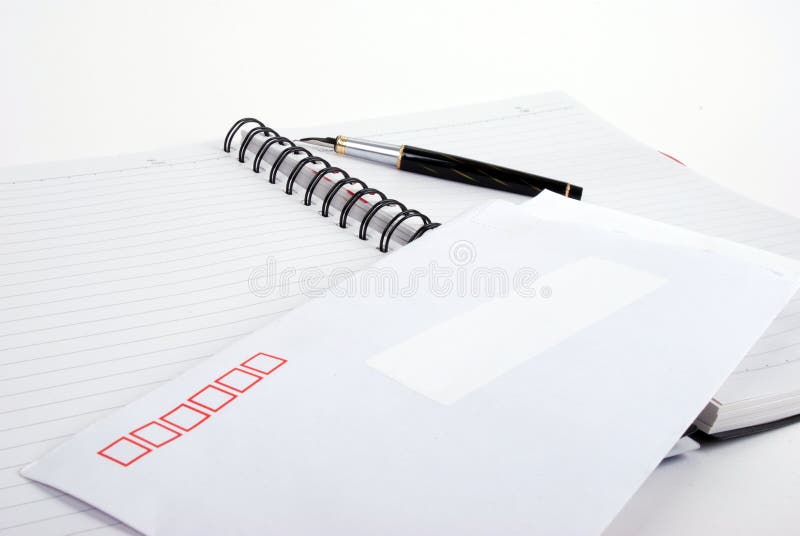 Pen and envelop on notebook