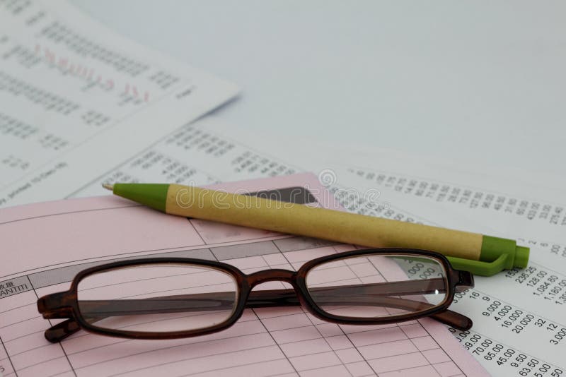 Pen,glass,Invoice and bill book. Business concept royalty free stock photo Pen,glass,Invoice and bill book. Business concept royalty free stock photo