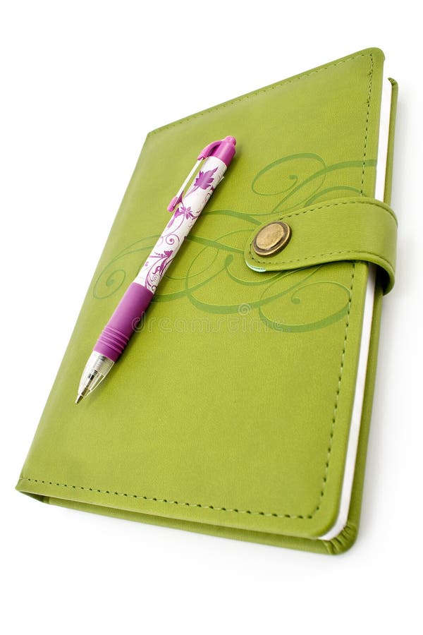 Pen and green notebook