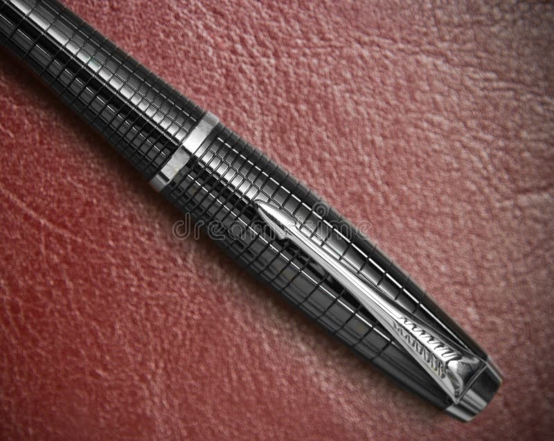 Pen on leather stock image. Image of burgundy, diary 16704837