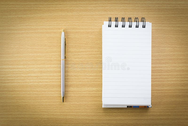 Pen and notepad with blank page