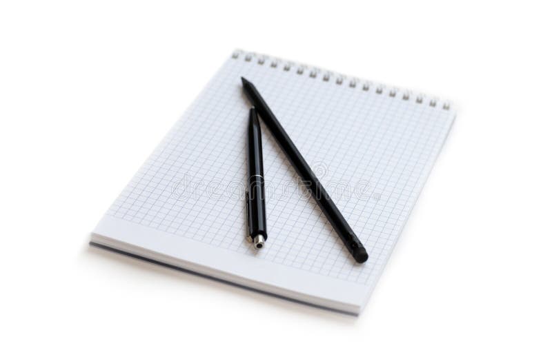 Pen and Pencil Lying on a Notebook in a Cage. Stock Image Image of