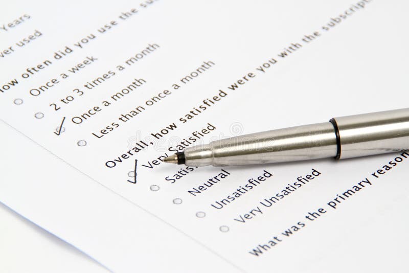 Pen Pointing at Survey and Questionnaire Form royalty free stock images