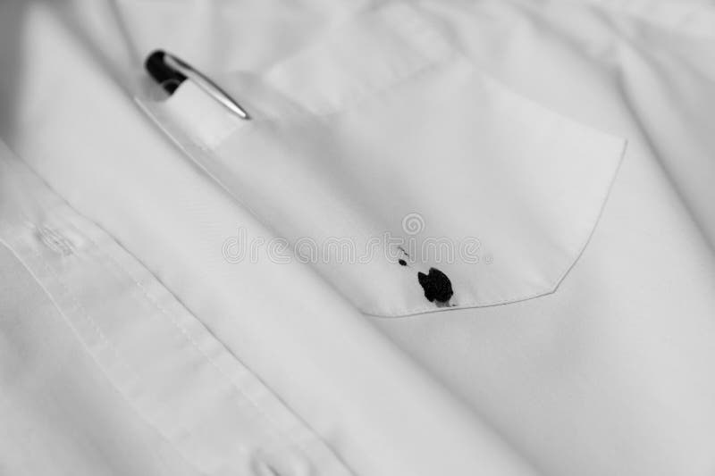 Pen and Stain of Black Ink on White Shirt, Closeup Stock Photo Image