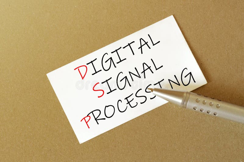 Pen, white paper with text DSP Digital signal processing on the brown background