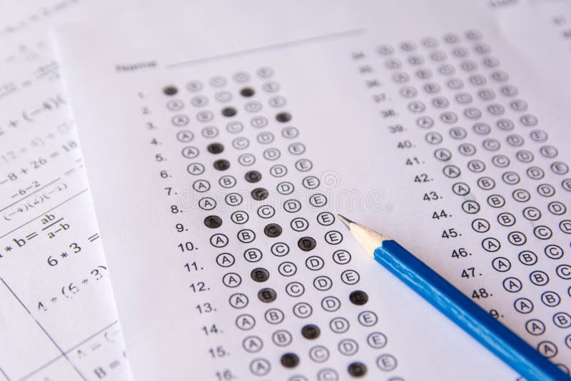 Pencil on answer sheets or Standardized test form with answers b stock images