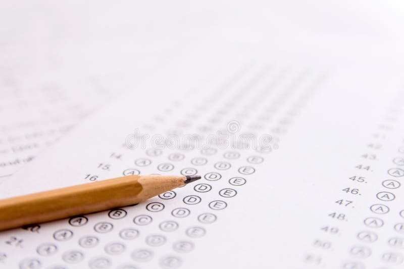Pencil on answer sheets or Standardized test form with answers b stock images