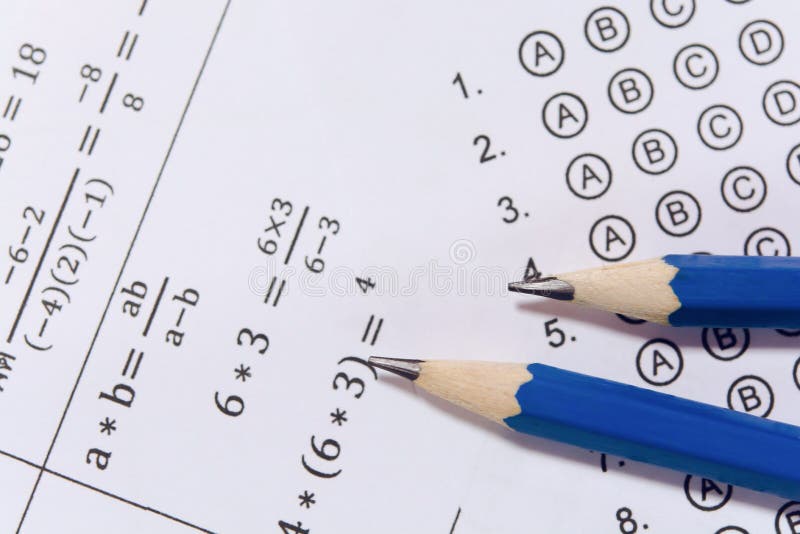 Pencil on answer sheets or Standardized test form with answers bubbled. multiple choice answer sheet royalty free stock image