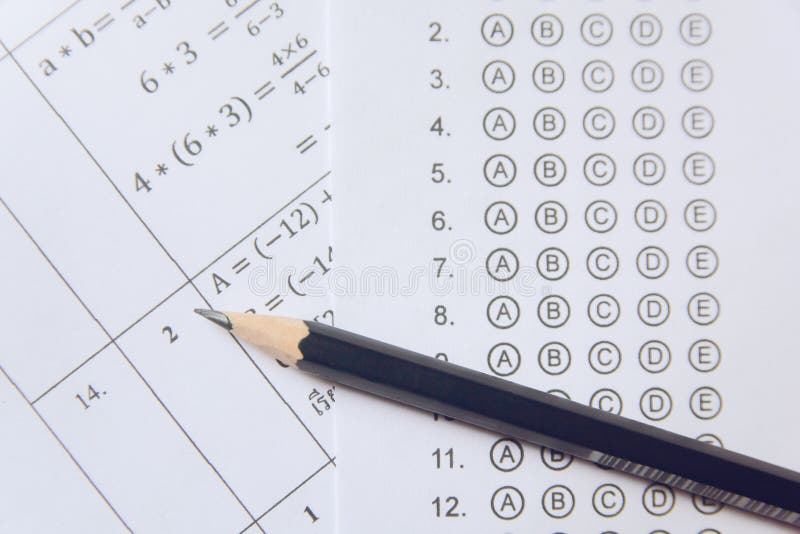 Pencil on answer sheets or Standardized test form with answers bubbled. multiple choice answer sheet royalty free stock photos