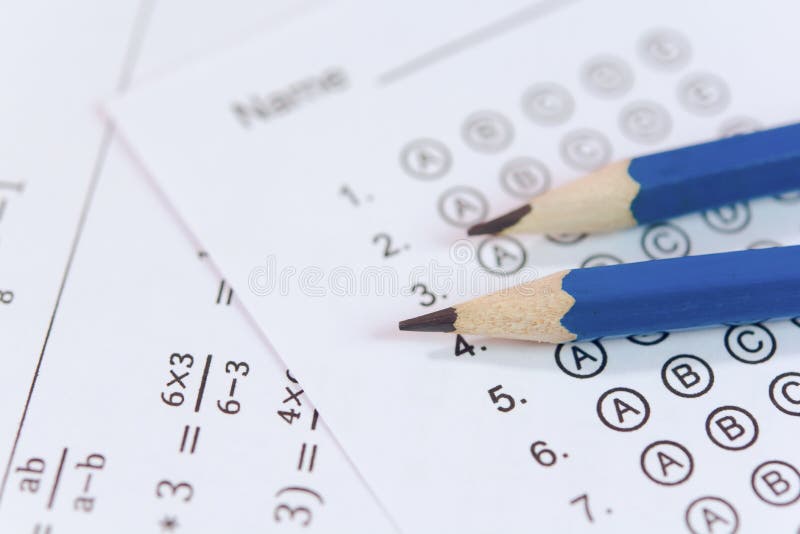 Pencil on answer sheets or Standardized test form with answers bubbled. multiple choice answer sheet stock photos