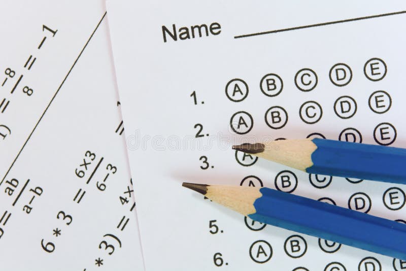 Pencil on answer sheets or Standardized test form with answers bubbled. multiple choice answer sheet royalty free stock photos
