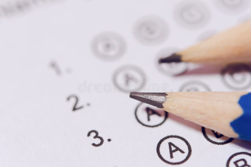 Pencil on answer sheets or Standardized test form with answers bubbled. multiple choice answer sheet stock image