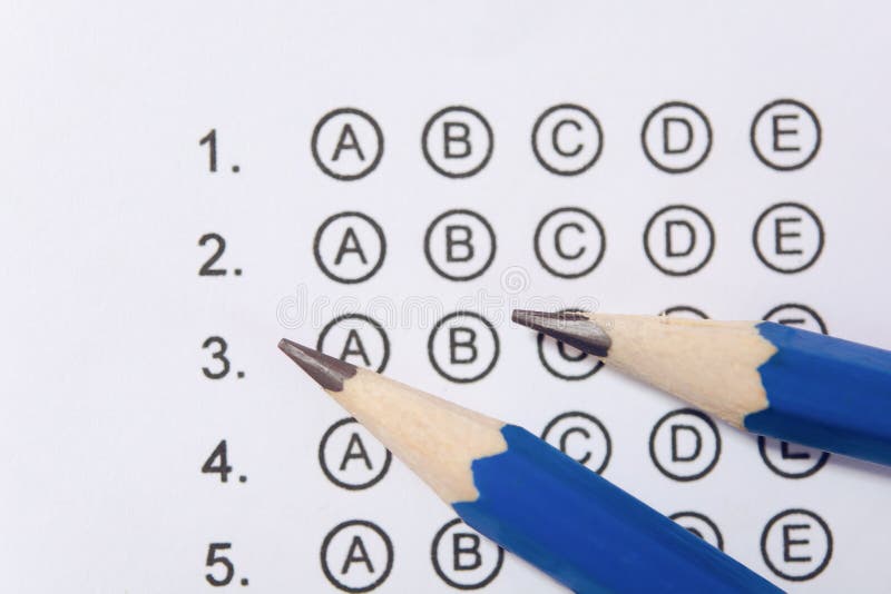 Pencil on answer sheets or Standardized test form with answers bubbled. multiple choice answer sheet stock photos