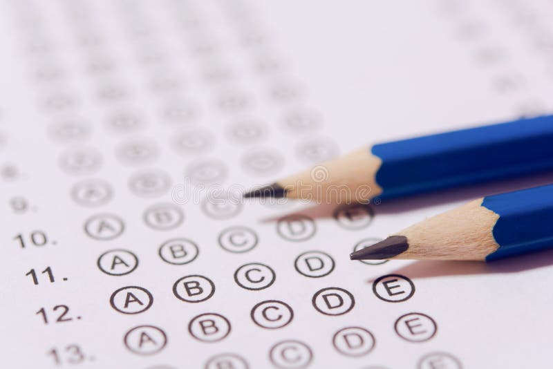 Pencil on answer sheets or Standardized test form with answers bubbled. multiple choice answer sheet stock photos