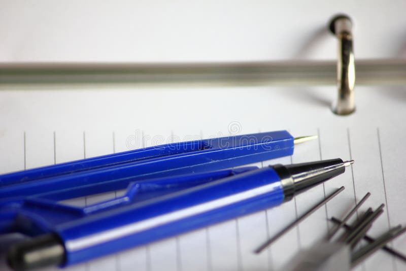 Pencil and blank pages with lines of open notebook diary. Close up blank pages with lines of open notebook diary