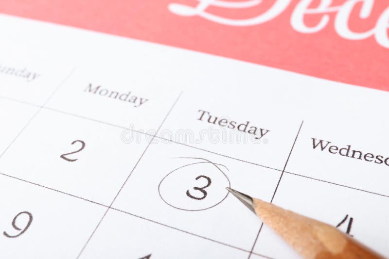 Pencil on calendar page with marked date royalty free stock photos