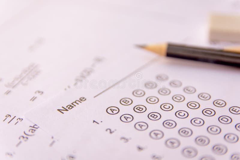 Pencil and eraser on answer sheets or Standardized test form with answers bubbled. multiple choice answer sheet stock photography