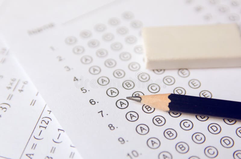 Pencil and eraser on answer sheets or Standardized test form with answers bubbled. multiple choice answer sheet royalty free stock photo