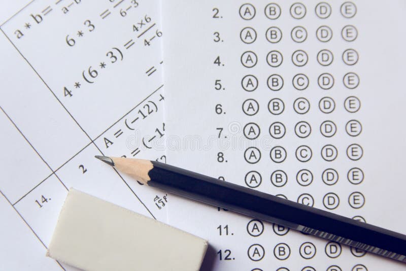 Pencil and eraser on answer sheets or Standardized test form with answers bubbled. multiple choice answer sheet stock photography