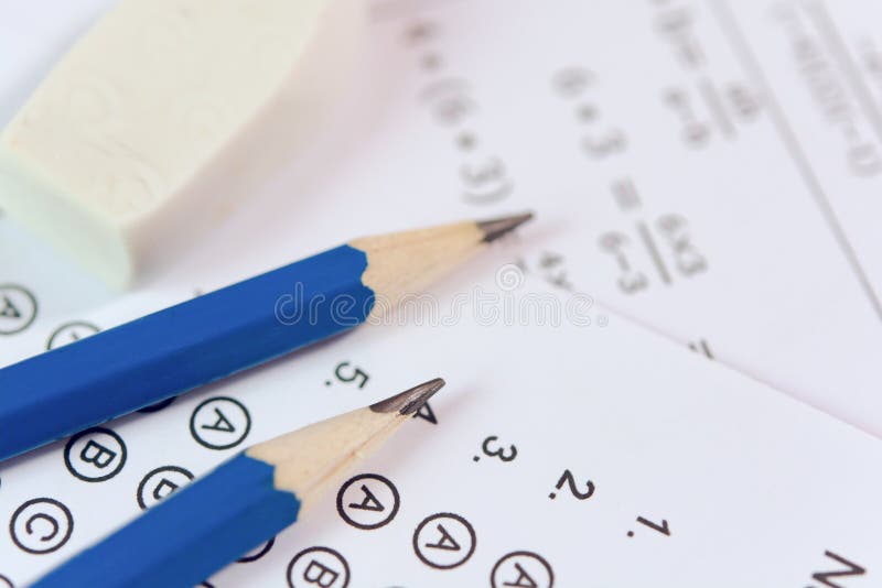 Pencil and eraser on answer sheets or Standardized test form with answers bubbled. multiple choice answer sheet stock images