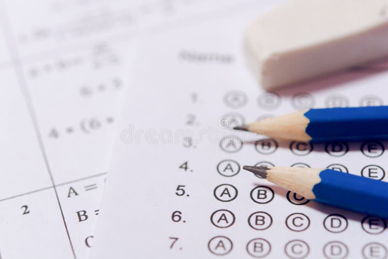 Pencil and eraser on answer sheets or Standardized test form with answers bubbled. multiple choice answer sheet royalty free stock photography