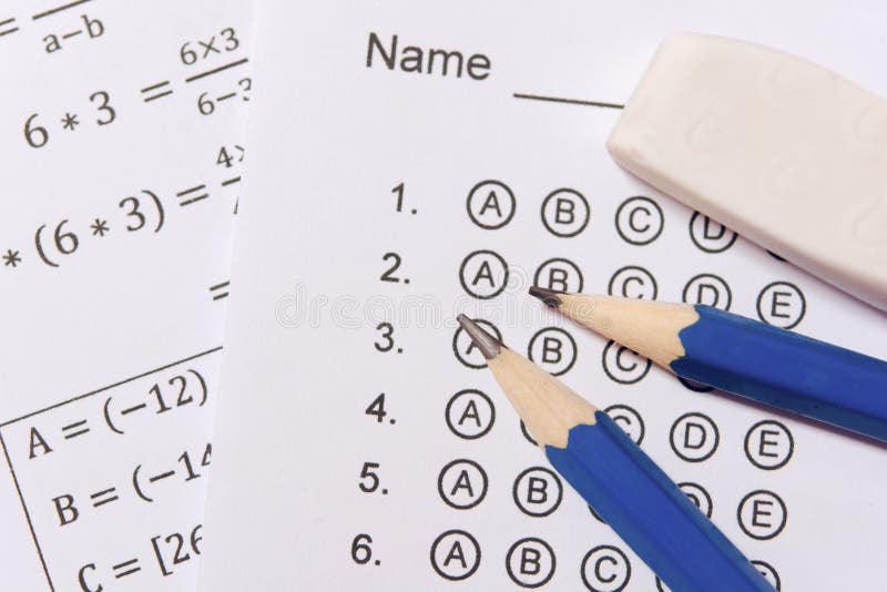 Pencil and eraser on answer sheets or Standardized test form with answers bubbled. multiple choice answer sheet royalty free stock photos