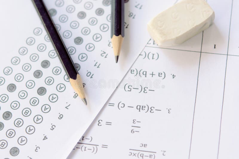 Pencil and eraser on answer sheets or Standardized test form with answers bubbled. multiple choice answer sheet stock photography