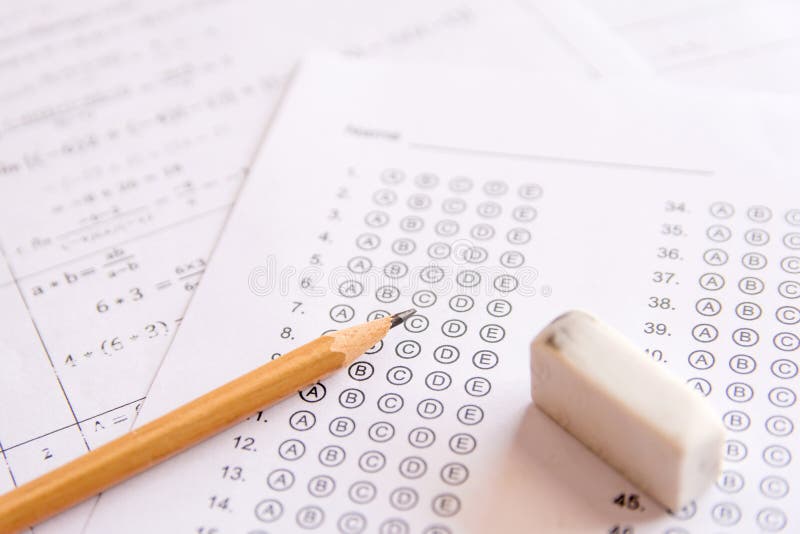 Pencil and eraser on answer sheets or Standardized test form wit stock image