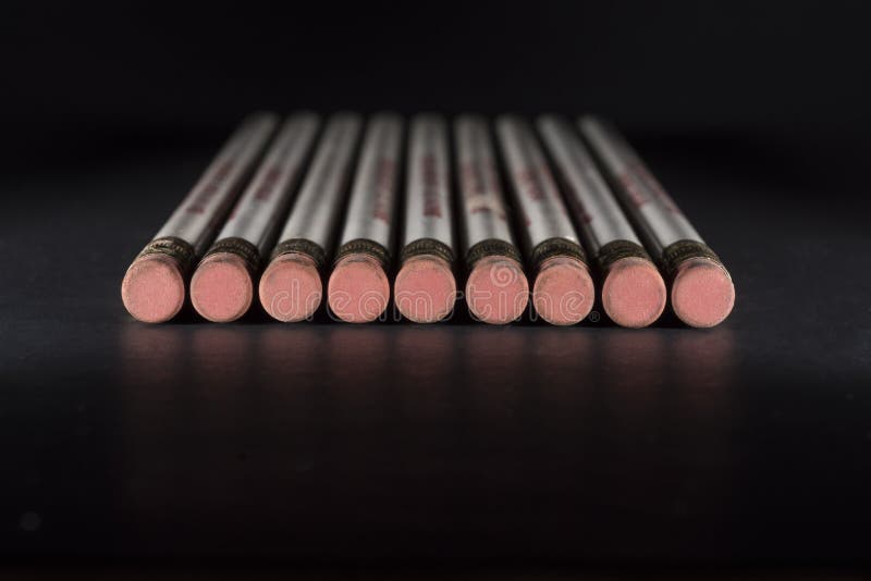 Pencil erasers on black surface stock photography Pencil erasers on black surface stock photography