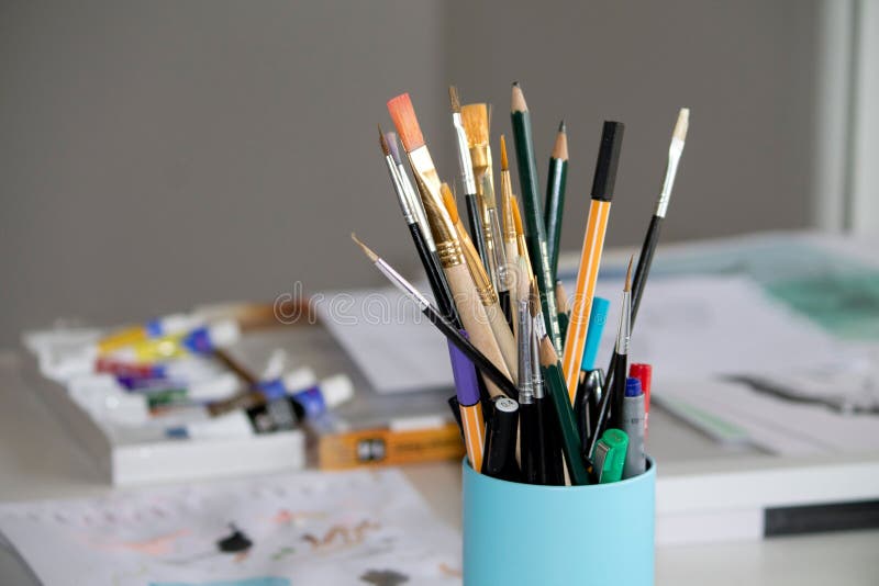 Pencil and Paint Brush on a Container Bowl Stock Photo Image of