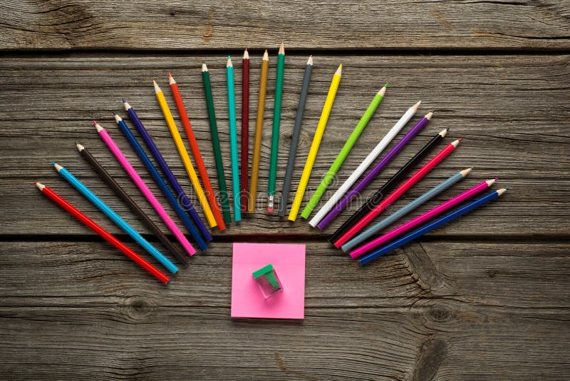 Pencil, pen and other school supplies on wooden table