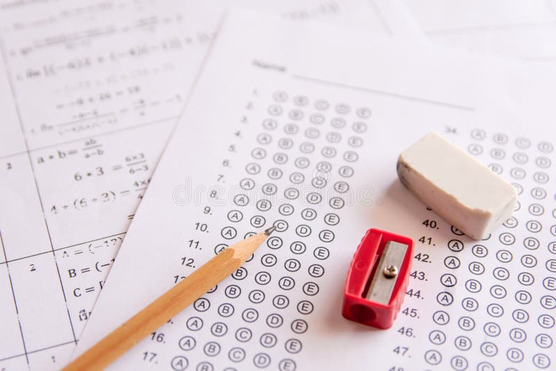Pencil, Sharpener and eraser on answer sheets or Standardized te royalty free stock image