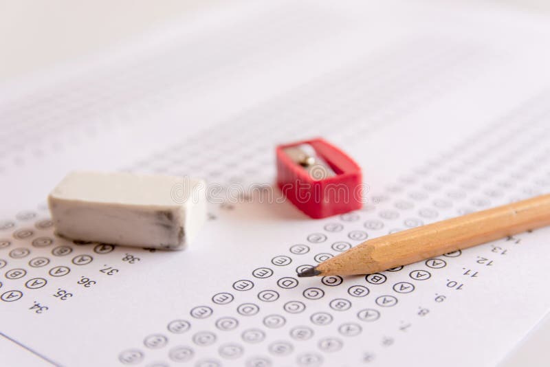 Pencil, Sharpener and eraser on answer sheets or Standardized te stock photography