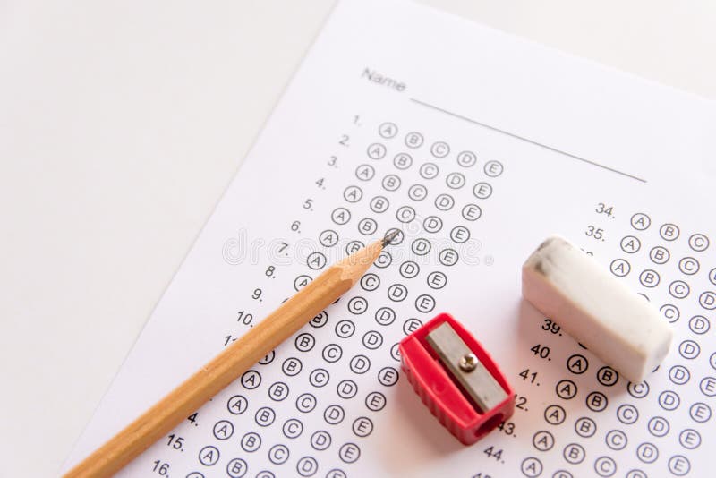 Pencil, Sharpener and eraser on answer sheets or Standardized te stock photos