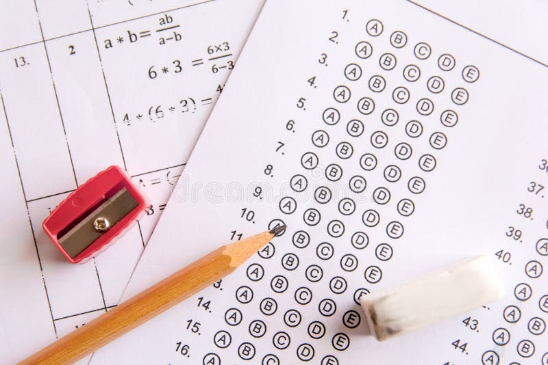 Pencil, Sharpener and eraser on answer sheets or Standardized te stock photo