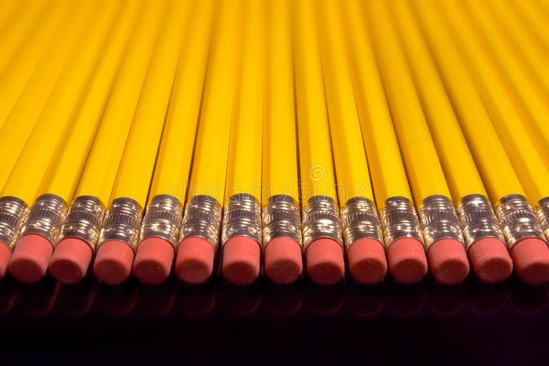 Imagine of colorful pens, markers, crayons in pencil box on yellow