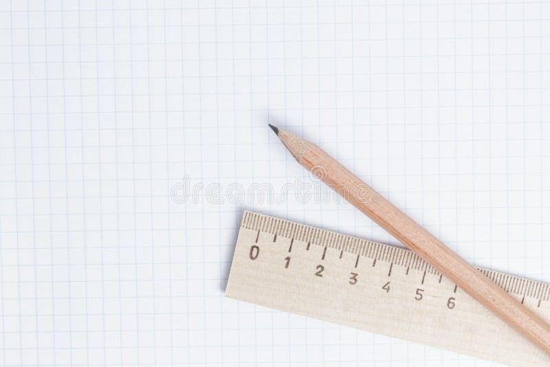 Pencils and ruler on notebook page