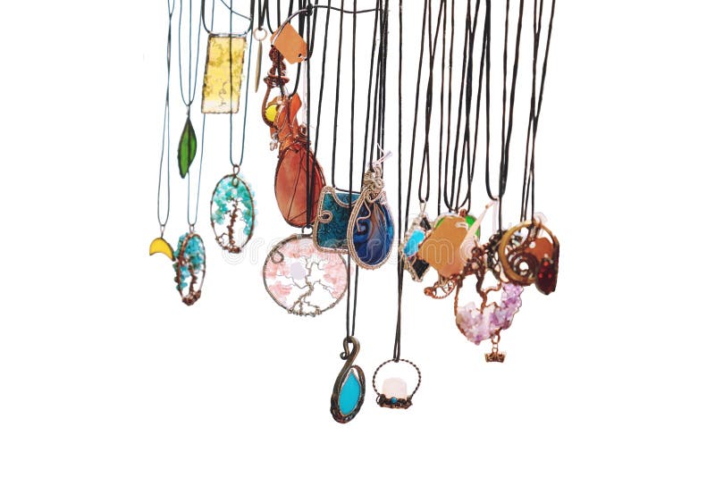 Pendants and Amulets with Precious Stones are Suspended on Chains