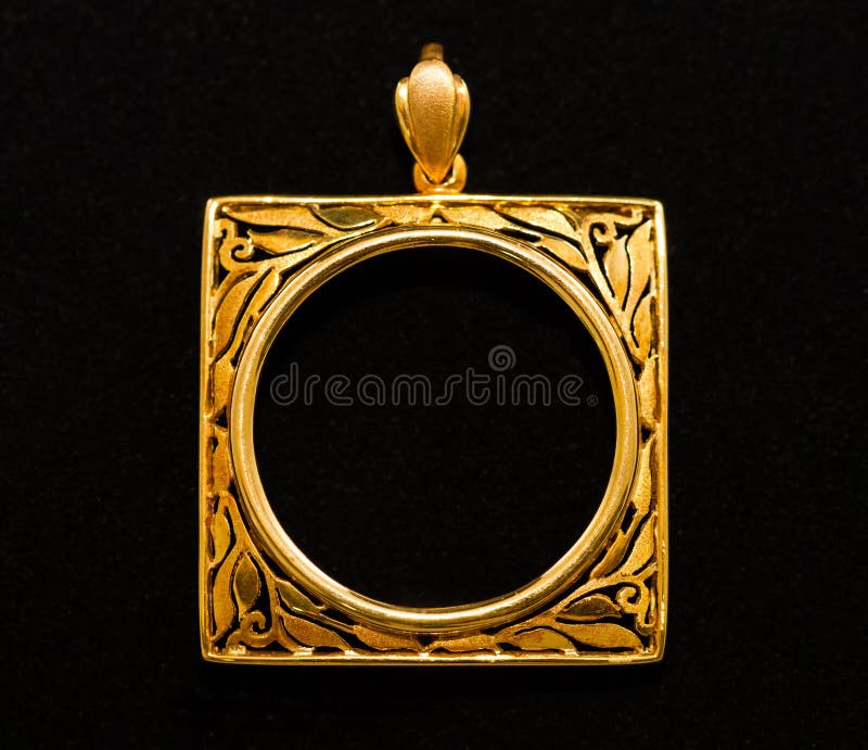Gold locket frame pendant on black background. Gold locket frame pendant on black background