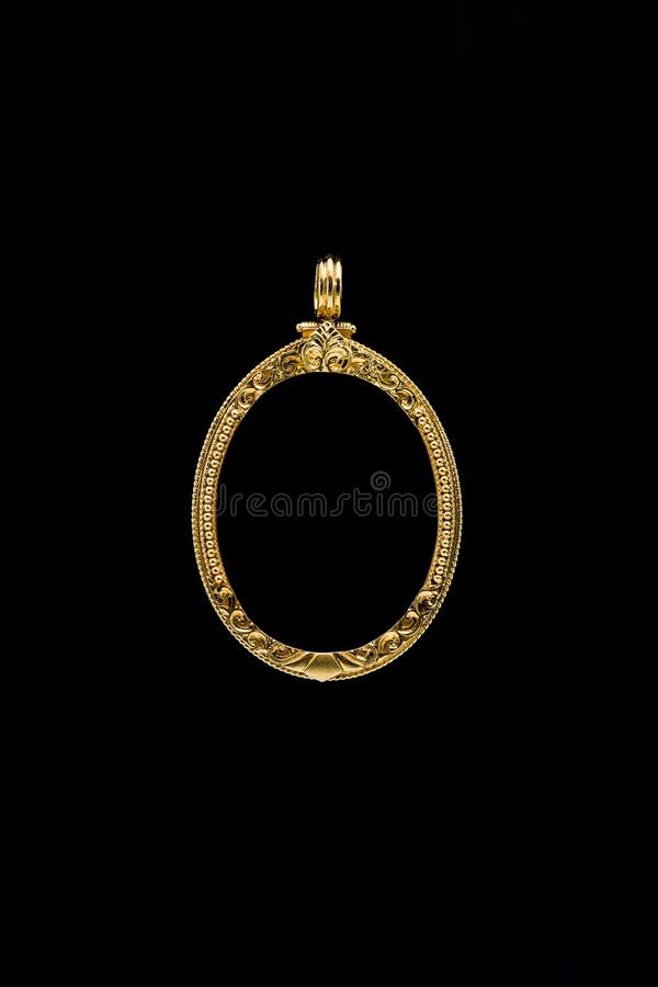 Gold locket frame pendant on black background. Gold locket frame pendant on black background