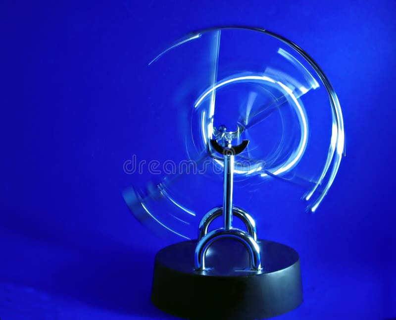 Perpetual motion pendulum on blue background. Perpetual motion pendulum on blue background