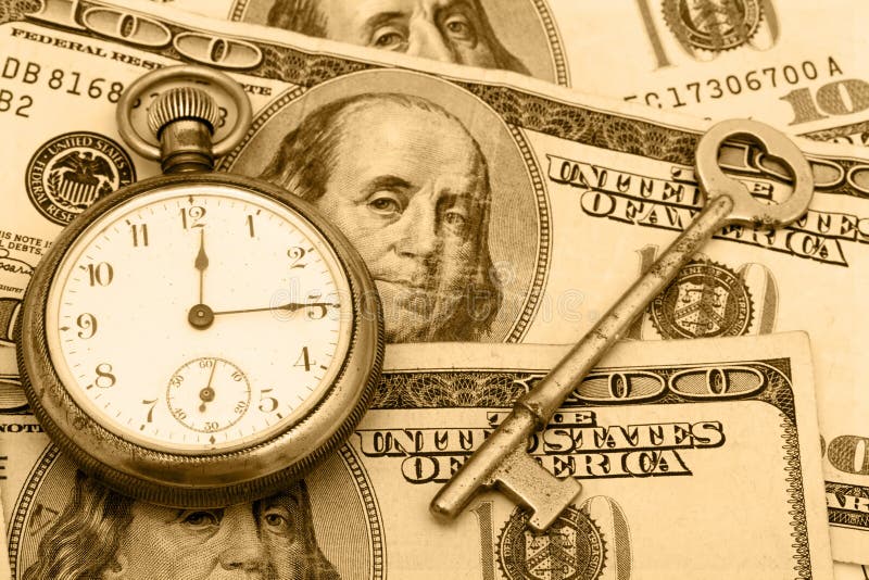 A pocket watch sitting with an antique key on a hundred dollar bill background, time management. A pocket watch sitting with an antique key on a hundred dollar bill background, time management