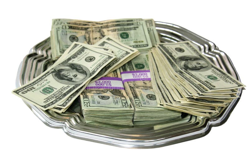 A silver platter covered in twenty and hundred dollar bills isolated over white. A silver platter covered in twenty and hundred dollar bills isolated over white.