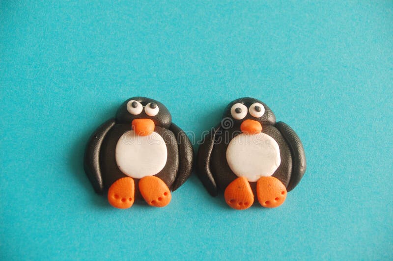 Two penguins made of polymer clay