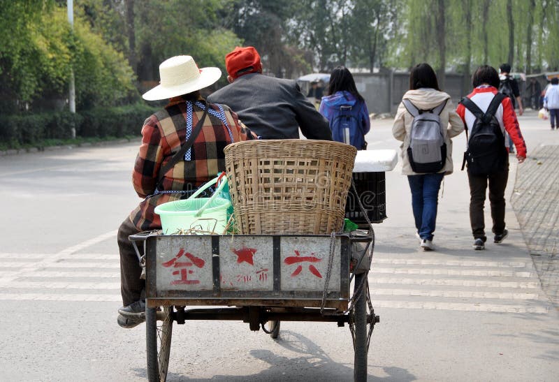 Pengzhou, China: Farmers in Bicycle Cart royalty free stock images