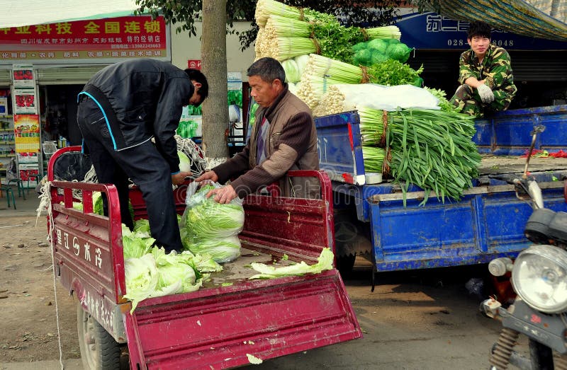 Pengzhou, China: Men Loading Produce stock photo