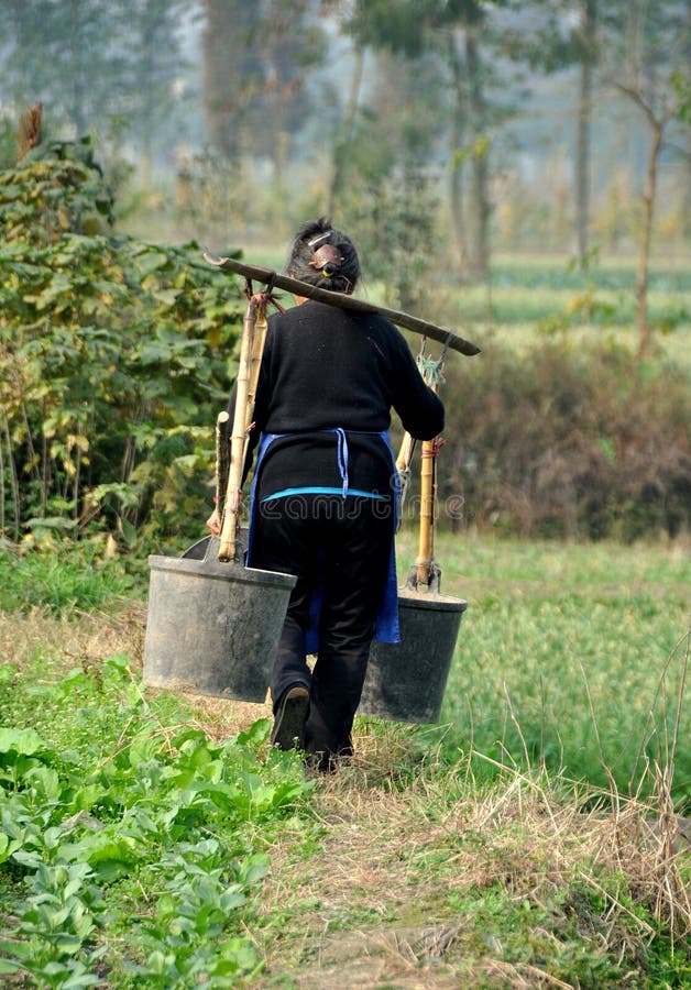 Pengzhou, China: Woman with Water Pails stock photography